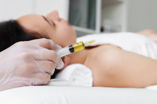 Healthcare professional administering peptide therapy at Elysian Institute in Montana